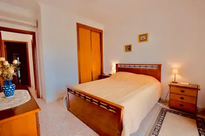 a bedroom with a bed and a dresser and a sink at Estrada de, Urbanizacao,edificio laranjal,apartment 18,vale carro, 8200-596 in Albufeira