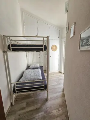 a bedroom with a bunk bed in a room at Casa Albufeira in Albufeira