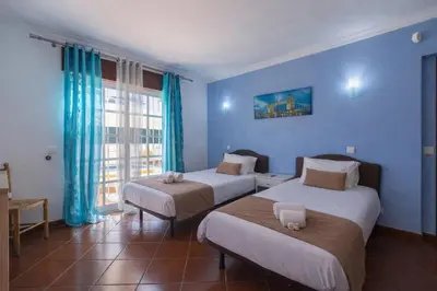 an aerial view of a city and the ocean at Villa Pacheco in Albufeira
