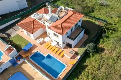 an aerial view of a house with a swimming pool at Villa Pacheco in Albufeira
