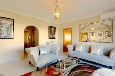 a living room with two couches and a glass table at Protea 214-CleverDetails, Located in heart of Vilamoura Sleeps 2 adults, 1child in Vilamoura