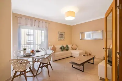a kitchen with a sink and a dishwasher at Almancil Park Apartment in Almancil