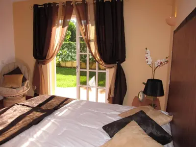 a bedroom with a bed in front of a window at 5 Bedroom Private Villa Tenazinha III, pool, garden, BBQ in Albufeira
