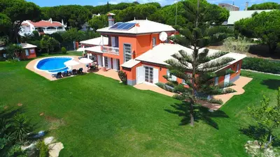 an aerial view of a house with a swimming pool at 5 Bedroom Private Villa Tenazinha III, pool, garden, BBQ in Albufeira