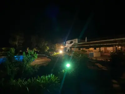 a street light in front of a building at night at Quinta Verde Albufeira in Albufeira