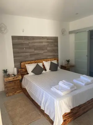 a bedroom with a large bed with towels on it at Quinta Verde Albufeira in Albufeira