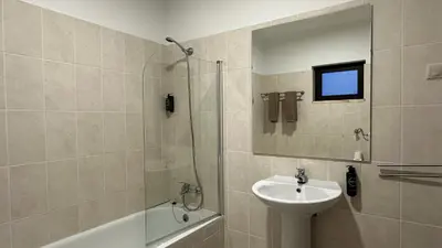 a bathroom with a sink and a shower with a mirror at Lili by Check-in Portugal in Sesmarias