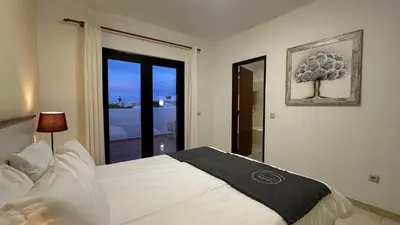 a bedroom with a white bed and a window at Lili by Check-in Portugal in Sesmarias