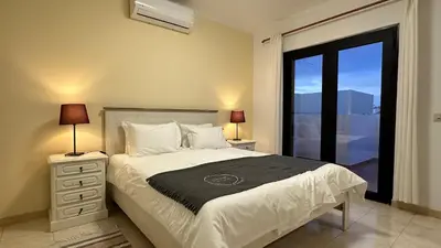 a bedroom with a large bed and a window at Lili by Check-in Portugal in Sesmarias