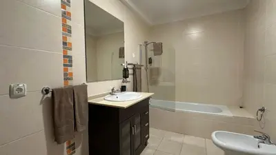 a bathroom with a sink and a bath tub at Lili by Check-in Portugal in Sesmarias