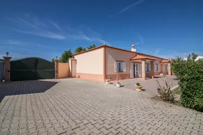 a house with a brick driveway in front of it at Casa Santa Maria in Boliqueime