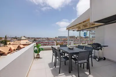 a table and chairs on a balcony with a view at Marina Vilamoura Penthouse Luxury in Vilamoura