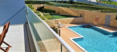 an overhead view of a swimming pool on a building at Albufeira beach apartment in Albufeira