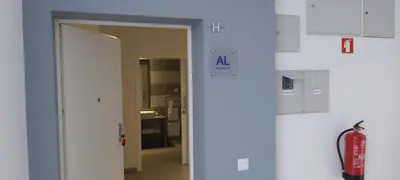an open door to a room with a fire extinguisher at Albufeira beach apartment in Albufeira
