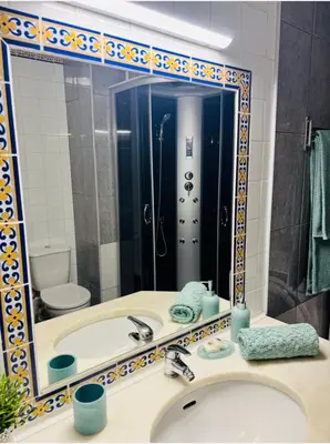 a white bathroom with a toilet and a sink at Happy House-fantastic holiday with all amenities in Albufeira