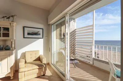 a kitchen and dining room with a table and chairs at Sail Away in Quarteira