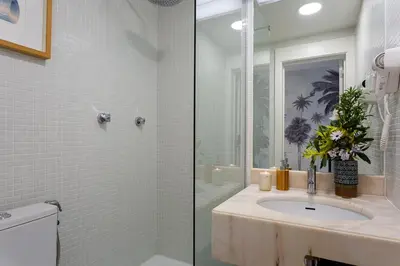 a bathroom with a sink and a shower at M&M Home in Quinta do Lago