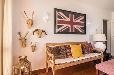 a living room with a couch and a table at Casa O12 in Vilamoura