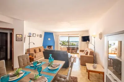 a living room with a couch and a table at Carolina Sea Apartment in Albufeira