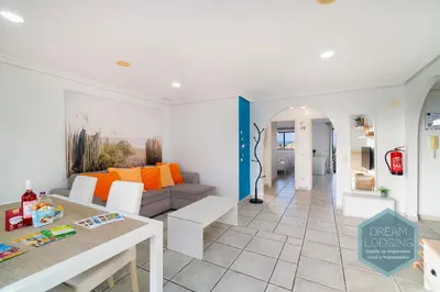 a living room with a couch and a table at Falésia Park - Dream Lodging in Albufeira