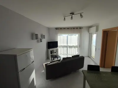 a living room with a couch and a table at Alsol C 5361-1 in Quarteira