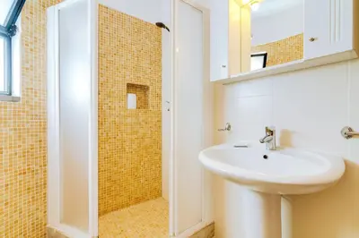 a bathroom with a sink and a shower at LovelyStay - Villa Mimi in Vilamoura