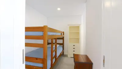 a bedroom with a bunk bed and a desk at Marina Parque 211-CleverDetails, Located in the Marina, Private Pool in Vilamoura