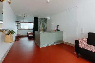 a living room with a couch and a table at THE MODERNIST, Architecture experience in Faro