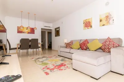 a living room with a couch and a table at Albufeira Sunny Apartment 2 With Pool by Homing in Galé