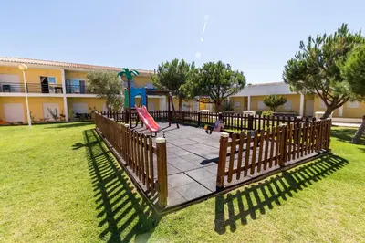 a park with a playground with a swing at Albufeira Sunny Apartment 2 With Pool by Homing in Galé