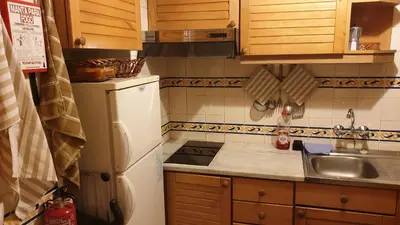 a kitchen with a white refrigerator and a sink at Vilamoura Marina Extraordinary 70 m2 T1, Marina 200m , beach 300m in Vilamoura
