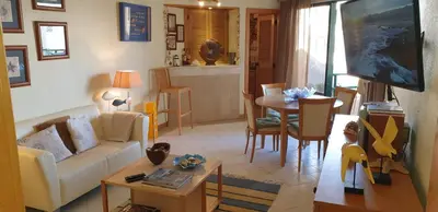a living room with a couch and a table at Vilamoura Marina Extraordinary 70 m2 T1, Marina 200m , beach 300m in Vilamoura