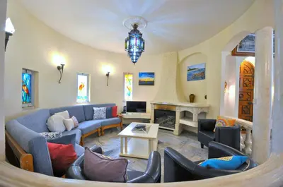 a kitchen with a large white counter top in a room at Spacious Retreat with Prime Location, Private pool, snooker, free AC Wifi in Quarteira