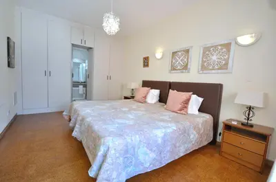a living room with couches and a tv and a fireplace at Spacious Retreat with Prime Location, Private pool, snooker, free AC Wifi in Quarteira