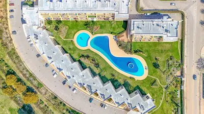 an overhead view of a pool at a resort at Jardins da Marina BI Albufeira Marina in Albufeira