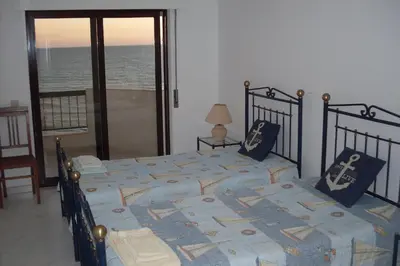 a bedroom with two beds with a view of the ocean at Quarteira, Algarve - Seaview - Horizonte Mar in Quarteira