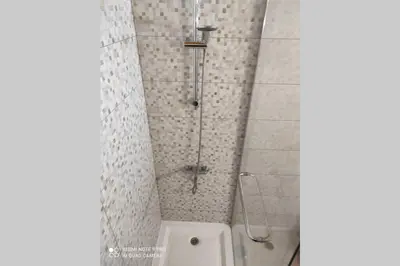a shower with a glass door in a bathroom at Fabulous Sea view Studio near old town Albufeira in Albufeira