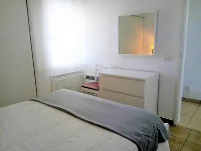 a small bedroom with a bed and a sink at T1 Praiamar 4 Vista Magnifica in Quarteira