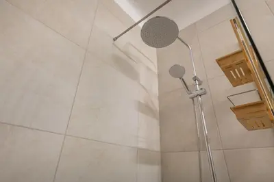 a bathroom with a toilet and a bath tub at Sunset Azul - Sea View - Free Wifi - By Bedzy in Albufeira