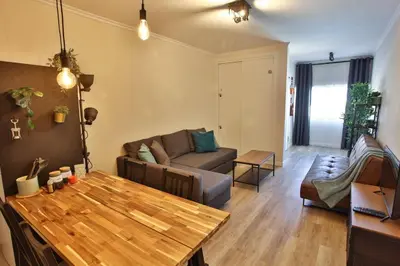 a living room with a couch and a table at Go4Portugal - Vilamagna - Luxe Condo with Pool, Airco and Seaview Balcony in Albufeira