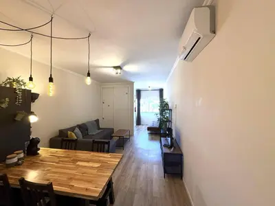 a living room with a table and a couch at Go4Portugal - Vilamagna - Luxe Condo with Pool, Airco and Seaview Balcony in Albufeira