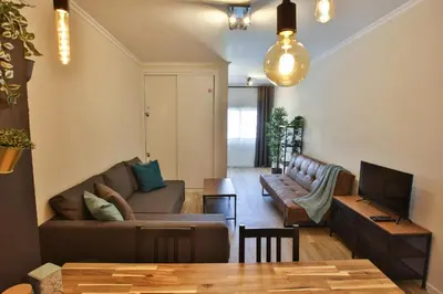 a living room with a couch and a tv at Go4Portugal - Vilamagna - Luxe Condo with Pool, Airco and Seaview Balcony in Albufeira