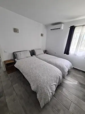 a bedroom with a large bed and a mirror at Oura - Large Villa - Private Pool - 5 Bedrooms in Albufeira