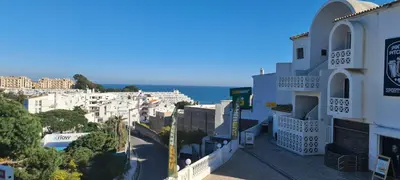a view of a city with the ocean in the background at 401 - 2 bedroom Apartment - Oura - Sea View in Albufeira