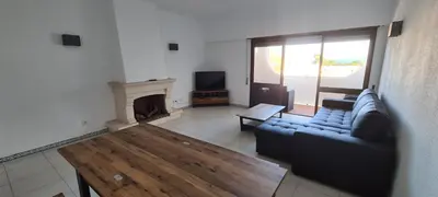 a living room with a couch and a fireplace at 402 - Oura - 2 Bedroomed Apartment - Sea View in Albufeira