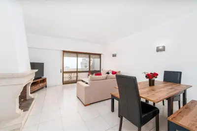 a living room with a table and a couch at 402 - Oura - 2 Bedroomed Apartment - Sea View in Albufeira