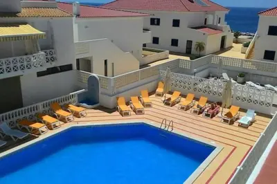 a villa with a swimming pool on top of a building at 402 - Oura - 2 Bedroomed Apartment - Sea View in Albufeira