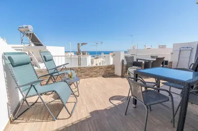 a kitchen with white cabinets and an orange arrow labeled home tutorials at #044 T1 Rossio by Home Holidays in Albufeira