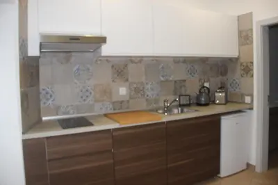 a kitchen with a sink and a counter top at Quinta do Sr. Cabrita in Albufeira