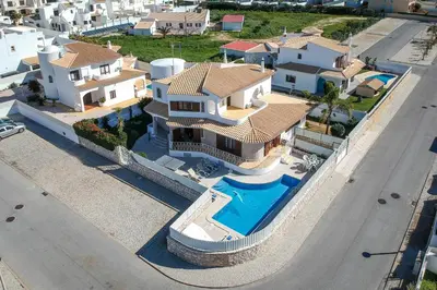 an aerial view of a house with a swimming pool at Villa Brisa do Mar in Galé